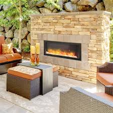 Modern outdoor fireplace designs are a long way from stacked cinder blocks. Install It Inside Or Outside This Electric Fireplace Is Amazing Built In Electric Fireplace Indoor Outdoor Fireplaces Outdoor Fireplace