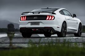 It means grand touring, usually the highest model of a car, can be found on many cars including the mustang, and the grand am, also in italian can be translated into gran turismo, a famous racing game for ps2. Sources Say Ford Mustang Sedan Apparently On The Table
