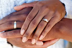 When two people fall in love and allow their life to reflect what really matters in life. Hands Of Married Couple Wearing Wedding Rings Engagement Ring On Hand Black Wedding Rings Wedding Ring Photography
