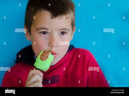 Little boy eating and enjoying the ice cream