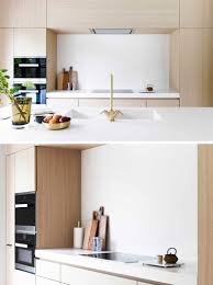 All light finishes from polished nickel to brass complement wood cabinetry. Light Wood And White Countertops Create A Neutral Softness In This Kitchen
