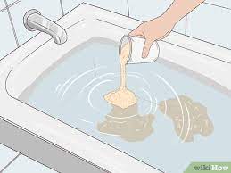 Put some oatmeal powder into a bathtub filled with warm water. 3 Ways To Make An Oatmeal Bath Wikihow