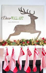 A beautiful shot of the christmas tree and reindeer on a sleigh wall decoration. Christmas Deer Wall Art