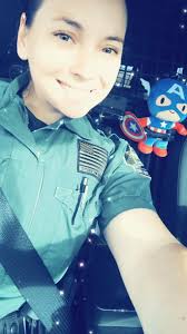 Deputy Makovic and Captain America practice Seat Bealt Safety.