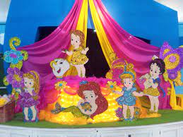 We taped characters to the cabinet doors, and standing princesses adorned the island around the food. Related Image Baby Party Decorations Disney Theme Party Kids Party Planning