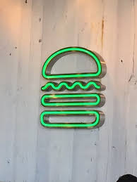 Shake shack sprouted from a hot dog cart in manhattan's madison square park created by danny meyer's union square hospitality group (ushg) to support the madison square park conservancy's first art installation. Logo Shake Shak Picture Of Shake Shack Dubai Tripadvisor