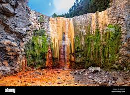 Cascada de los Colores in Caldera de Taburiente national park with its  wonderful color cascades Stock Photo - Alamy