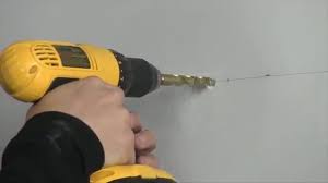 Drilling holes to create space to store lawn chairs