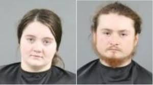 A man and woman were taken into custody after their child was found in a  house full of raccoons and a decomposing goat. Police Chief Miller said the  suspects' lack of expression