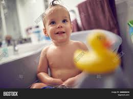 What is the advantage of having such a vibrant colour for an infant? Funny Baby Taking Bath Image Photo Free Trial Bigstock