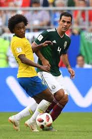 Brazil S Forward Willian Vies For The Ball With Mexico S Midfielder Rafael Marquez During The Russia 2018 World Cup Round Of 1 Midfielder Football Match Soccer
