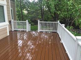 Brown deck with white railing