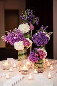 Purple Wedding Ideas With Sophistication Modwedding Purple Centerpieces Purple Wedding Centerpieces Wedding Decor Elegant