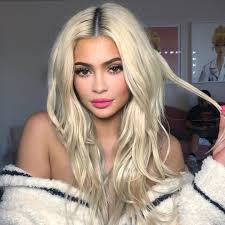 With that comes new fall fashions and hair and make up trends to warm up out winter. Kylie Jenner Models Two Different Make Up Looks With Long Blonde Hair Before Showing Off Her Curves In Black Dress