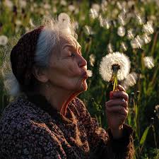 Free Elderly woman blowing Image
