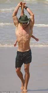 And Stretch Chris With One Of His Child Chris Hemsworth Kids Chris Hemsworth Shirtless Hemsworth