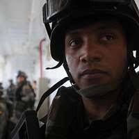 US Navy 100527-N-7364R-217 Portuguese navy visit, board, search and seizure  team members verify ship documents aboard the Military Sealift Command  container and roll-on-roll-off ship USNS LCPL Roy M. Wheat (T-AK 3016) -