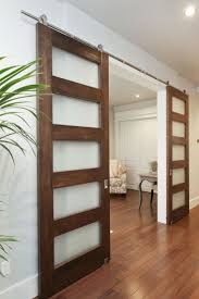 Space Saving Attractive Barn Doors With Frosted Glass Inserts Design Puertas Interiores De Madera Decoracion De Casas Modernas Puertas Corredizas De Vidrio