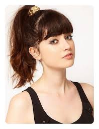 Her luscious brown curls fall from the ponytail down over one shoulder in a truly striking style. 97 Amazing Ponytail With Bangs Hairstyles