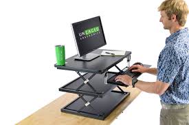 The keyboard shelf weight capacity is 25 lbs; Sit Stand Desk Converter Adjustable Standing Desktop Computer Riser