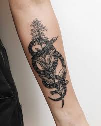 Other more macho designs for men include barbed wire, snake, celtic, and writing designs that wrap around the bicep. Snake Wrapped Around A Flower Tattoo Inked On The Left Forearm By Finley Jordan Arm Tattoos For Women Around Arm Tattoo Tattoos