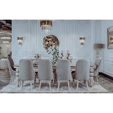 Our final corner dining set is another solid example of sleekly modern style, with a glossy white tabletop mounted on an angled white stand with stainless steel accents and base. Benita Dining Table And Chairs Set Tulip Interiors
