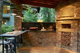outdoor kitchen with wood burning pizza
