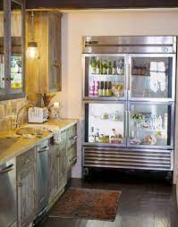 Overall satisfied with our kitchen aid refrigerator we have owned our kitchen aid refrigerator since 1994 as we bought it when we purchased our new home. Rustic Kitchen In Los Angeles Glass Door Refrigerator Rustic Kitchen Natural Kitchen Design