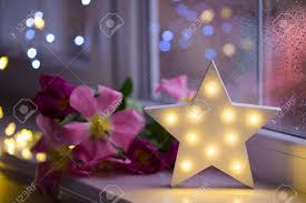 Whether its animated singing reindeers, huge string light sets to cover a village tree or 12ft display christmas nutcracker we really do have something for everyone. White Led Star With Pink Tulips On Warm Bokeh Background Indoor Stock Photo Picture And Royalty Free Image Image 96939550