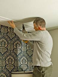 We chose the white painted shiplap style. How To Install A Planked Wood Ceiling Hgtv