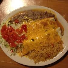 Beef And Chicken Burritos Smothered With Cheese Lettuce Tomatoes Refried Beans Mexican Food Recipes Best Refried Beans Recipe Mexican Food Recipes Authentic