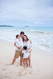 Happy mother and smiling father with two children, son and daughter, having fun during summer holiday. Family Portrait On A White Sand Beach Hawaii Family Photographer Gallery