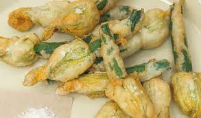 Check out this video below from white on rice couple. Boast Of Roman Food Tradition Fried Zucchini Flowers