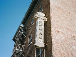 Image result for hotel being rebuilt with sign that says there was a spider