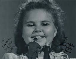 Does anybody know the name of the actress who played the laughing little  girl
