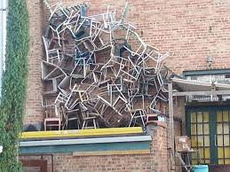 Stacked Chairs Somewhere In Sawyer Michigan This Is The Back Side Of An Antique Shop Near Sawyer Garden Center Antique Shops Garden Center Antiques