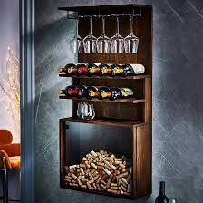 Fits wine bottles nicely and has racks for glasses , and i can place a plant or other decorative item on top. Wall Mounted Wine And Stemware Rack With Cork Catcher Wine Enthusiast