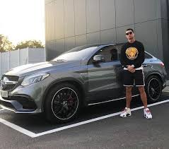 Upscalehype On Instagram Cristiano Stands By His Mercedesbenz Wearing A Versace Sweater And Jum Cristiano Ronaldo Style Ronaldo Football Cristano Ronaldo