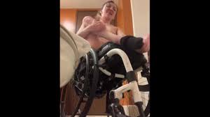 Disabled girl undressing in wheelchair