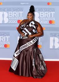 Lizzo Goes Quirky In Hershey S Chocolate Bar Dress At The 2020 Brit Awards In 2020 Brit Awards Female Rappers Red Carpet Fashion