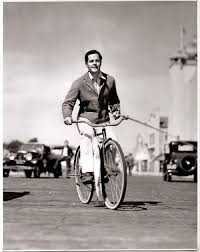 Donald Woods Rides A Bike With A White Sea Bass Caption Donald Woods Bicycles Home From Santa Monica Pier With The Fish He Caught On A Recent Expedition T