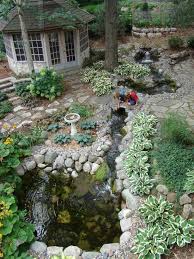 Paver patios and walkways, retaining walls, hardscape, flower bed installation, snow removal, sod. This Massive Collection Of Photos Ideas And Simple Step By Step Details Of Landscaping Traditional Landscape Garden Pond Design Water Features In The Garden
