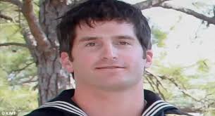 Tearjerker: Loyal dog who lay by his Navy SEAL master's coffin during  funeral to be football mascot in soldier's home state