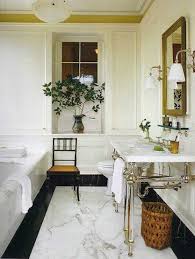 See how top interior designers use luxurious marble tubs to elevate and transform these bathrooms. Gil Schafer Classic Marble Bathroom Home American House House Interior