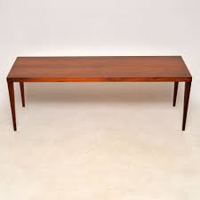 Midcentury danish rosewood rectangular coffee table with tapered legs and sliding tray ends. 1960 S Danish Rosewood Coffee Table By Sven Ellekaer Retrospective Interiors Retro Furniture Vintage Mid Century Furniture Vintage Danish Modern Furniture Antique Furniture London