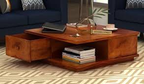 A dark toned coffee table deserved a glass top to light up its bulky appeal and reflect light beautifully. Nifty Tips To Make Coffee Tables Purchase Easier And Convenient
