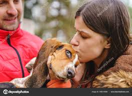 Young Couple Man Woman Male Female Playing Basset Hound Dog — Stock Photo ©  Miljan #546210084