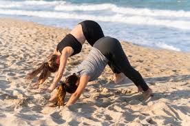 Maybe you would like to learn more about one of these? Premium Photo Two Women Doing Yoga Poses On The Beach