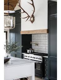 The cabinets are manufactured from silver melamine faced chipboard (mfc) but the door & drawer fronts are manufactured from stainless steel. Black Kitchen Cabinets With Black Stove Country Kitchen