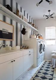 Think style, sophistication and a chic laundry closet in black and white. Galley Style Laundry Room With Black And White Vertical Stripe Wallpaper Transitional Laundry Room